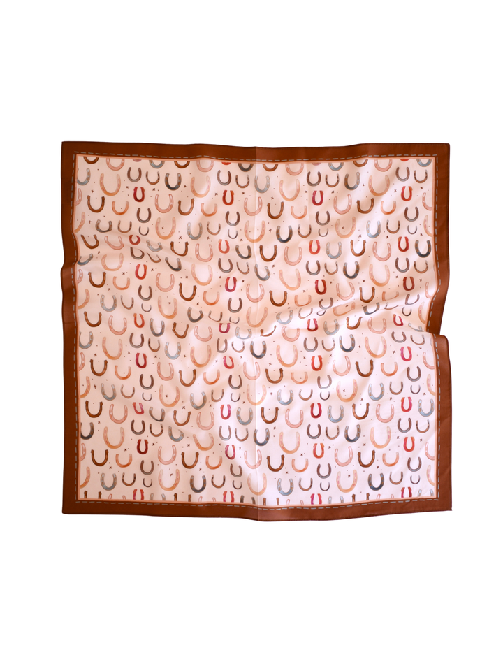 Simple Horseshoes in Natural 26x26 wild rag laid flat, featuring an all-over horseshoe pattern on cream